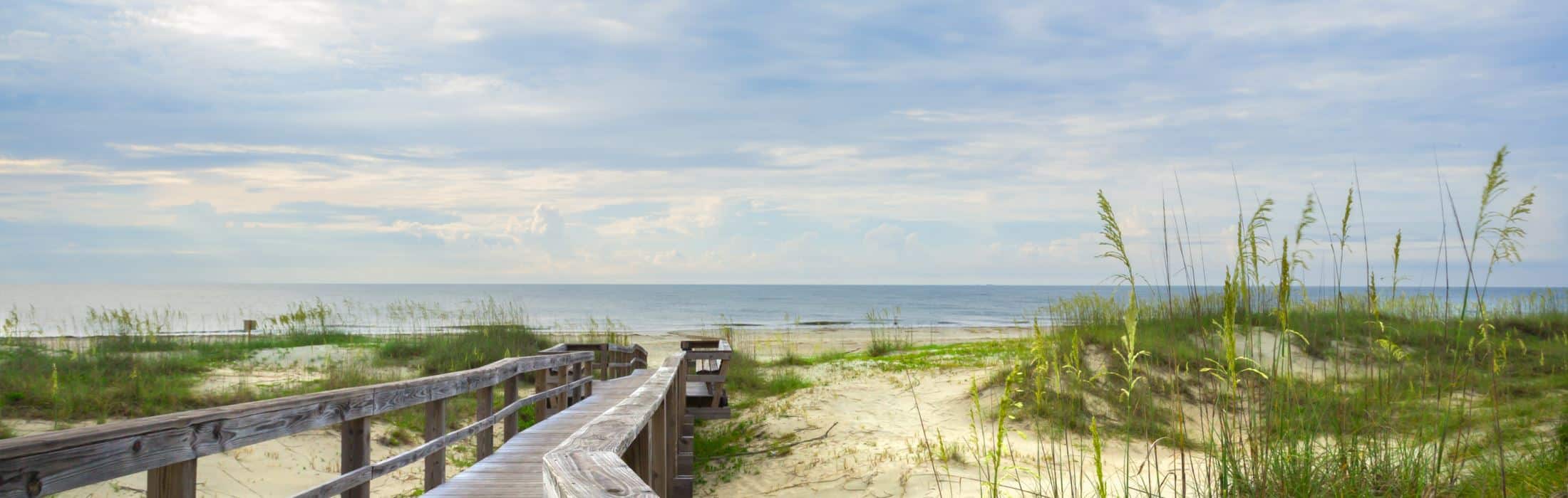 Tybee Beach Walkway leading to the ocean from a luxury home