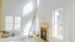 Side-by-side comparison of an outdated light fixture and a modern, updated fixture in a well-lit home interior.