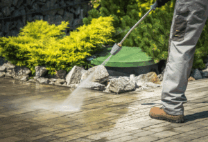 Homeowner boosting curb appeal with gardening and landscaping in Savannah neighborhood