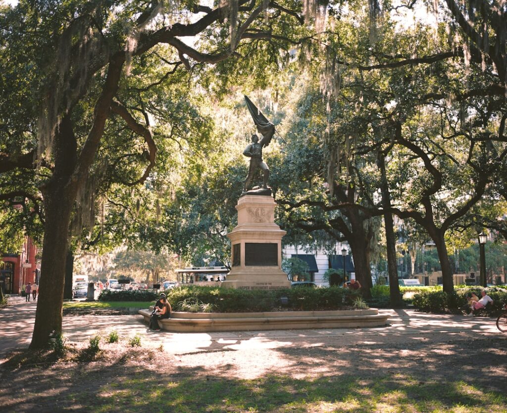 Classic historic home in Savannah, Georgia, bathed in bright sunlight, showcasing the unique architecture that local zonin...